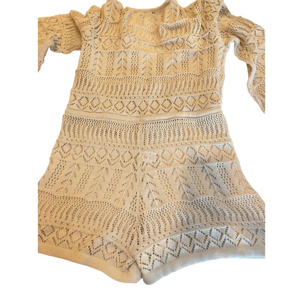 Marmalade crochet knit romper 
Cross lv neck front, bell sleeves.Off white 
Med